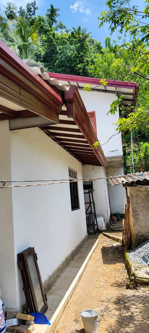 Gutter and fascia installation along the side of a house