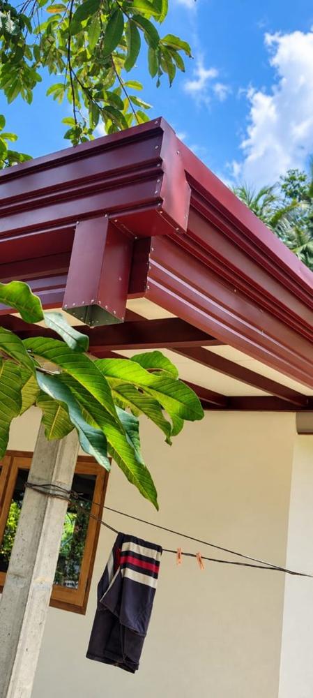 Maroon gutter and fascia corner detail