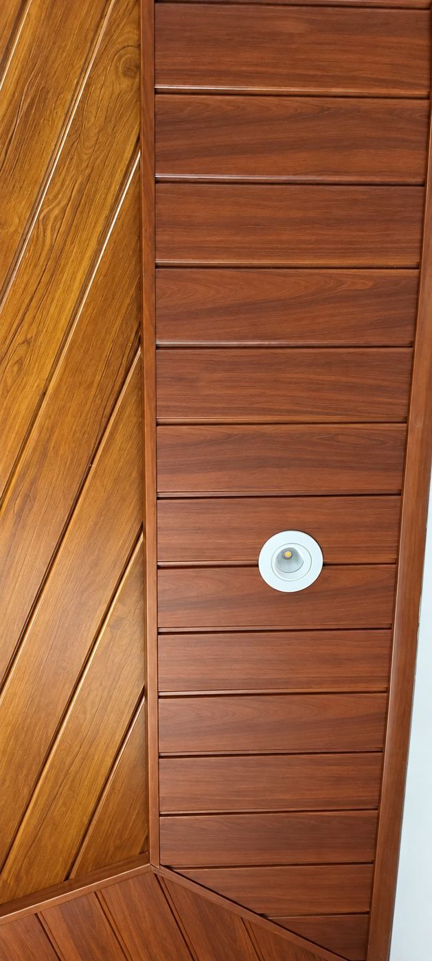 Walnut plank ceiling with diagonal accent